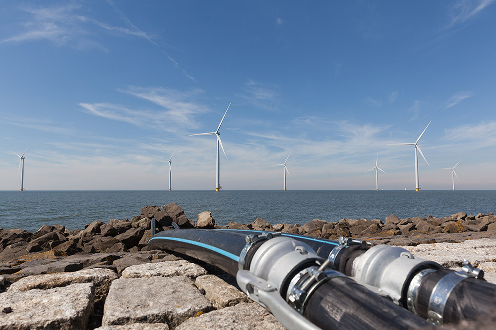 Offshore Wind Farm With Cables In The Foreground